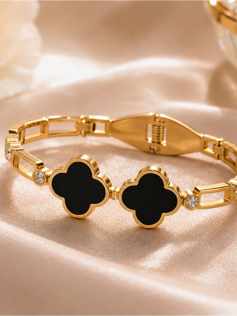 Elegant Gold Bracelet with Black Clover Accents